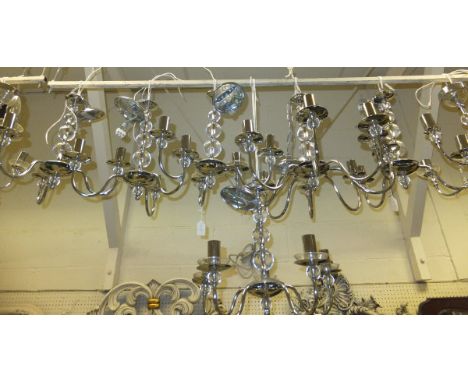 A collection of 13 matching modern chromed electroliers and 3 wall light fittings with clear spherical decoration and cut gla