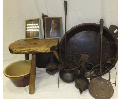 A treen ware bowl, bread paddle, iron skimmer and ladle, two 17th / 18th Century iron cruise lamps and three early (12th-14th