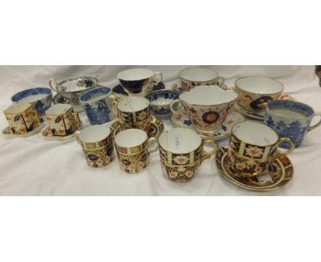 A collection of 18th and 19th Century English teacups and saucers, together with Royal Crown Derby coffee cans, etc