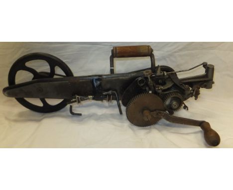 A Singer Manfg Co. / Simane hand-held carpet sewing machine 