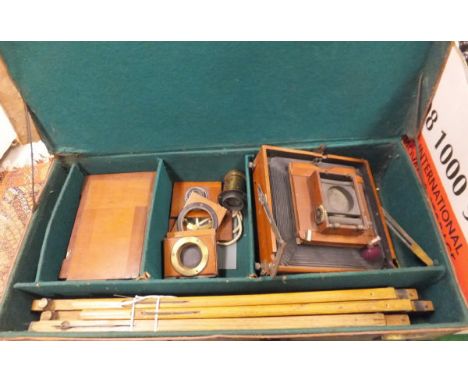 A collection of vintage photographic equipment and a brown leather case to include a "Special Ruby" Thornton-Pickard mahogany