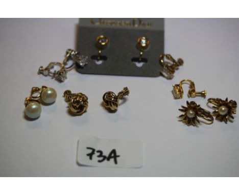Quantity of clip on earrings, including Christian Dior