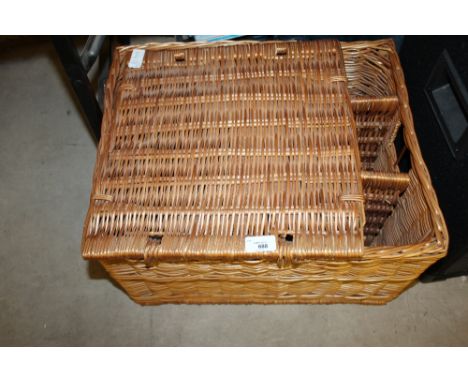 Wickerwork hamper and brass light fitting