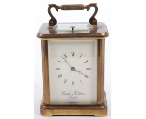 A 20th century brass carriage clock, signed Charles Frodsham London, enamel dial, Roman numerals, 17.5cm to top of handle