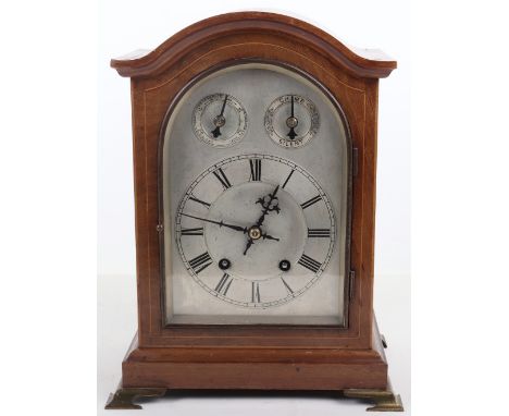 A 19th century mantle clock, silvered dial, with chime and silent dial and fast and slow, Roman numerals, walnut case, raised