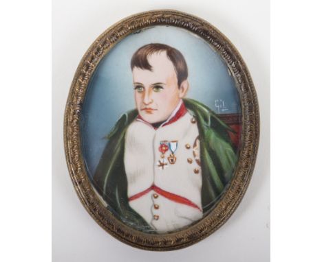 A portrait miniature of Napoleon, signed Gil, in oval brass frame