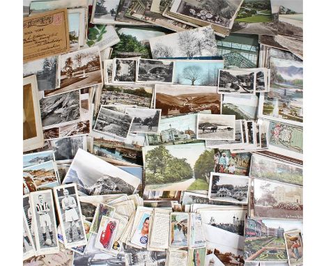 Collection of vintage postcards and cigarette cards including examples of footballers, cricketers, military uniforms, wildlif