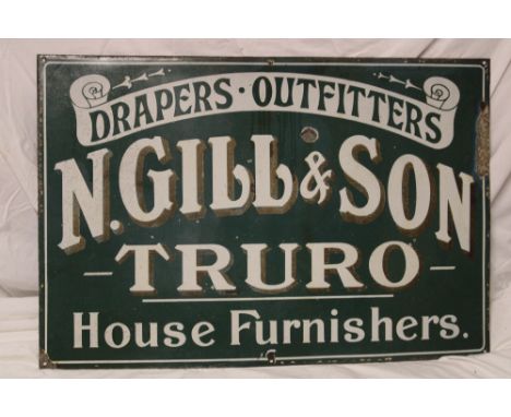 An old enamel rectangular Cornish advertising sign "N Gill &amp; Son Truro - Drapers, Outfitters, House Furnishers", 24" x 36