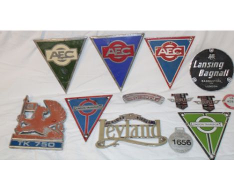 A selection of various commercial vehicle badges and emblems including two enamel London Transport badges, three AEC enamel b