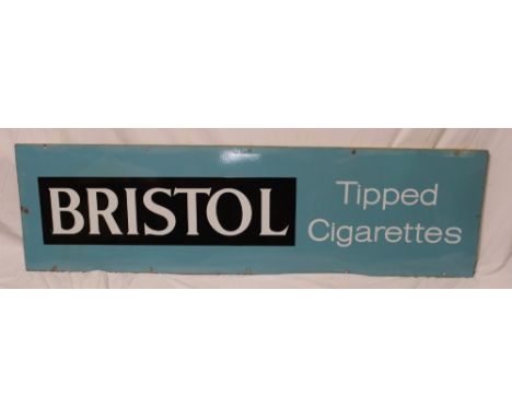 An enamel rectangular advertising sign "Bristol Tipped Cigarettes", 17" x 60"