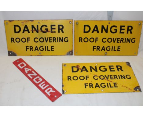 Three enamel rectangular warning signs "Danger Roof Covering Fragile", 7" x 13" and one other enamel danger sign, 12" x 2" (4