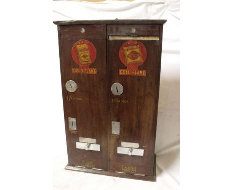 An old twin section Wills's Gold Flake cigarette vending machine in polished mahogany and chrome mounted cabinet, 23½" x 15" 