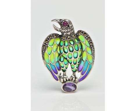 A PLIQUE A JOUR, RUBY AND AMETHYST BIRD BROOCH/PENDANT, the bird of prey with ruby set eye detail, to the green, yellow, blue