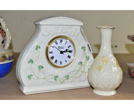 A BELLEEK CERAMIC DAISY CLOCK, green backstamp, quartz movement, approximate height 20cm, together with a Belleek onion shape