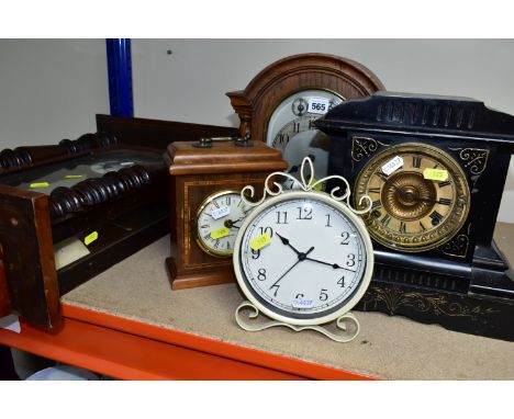 A COLLECTION OF FIVE CLOCKS, to include a late 19th century black slate mantel clock, made by Ansonia Clock Co. U.S.A, height
