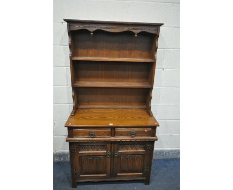 AN OLD CHARM DRESSER, top with two tier plate rack, base with two drawers over two cupboard doors, width 93cm x depth 44cm x 
