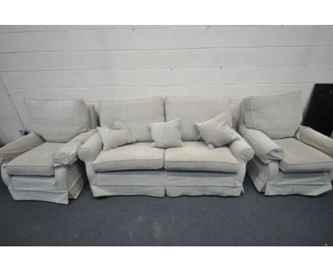 A MULTIYORK THREE PIECE LOUNGE SUITE, comprising a three seater sofa, and two armchairs (condition - some stains)