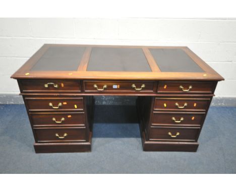 A HARDWOOD PEDESTAL DESK, with triple black leatherette writing surface, and an arrangement of five drawers, and a single cup