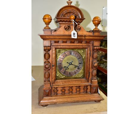 A WALNUT CASED CHIMING  MANTLE CLOCK, possibly with a replacement dial and movement, the silvered chapter ring has roman nume