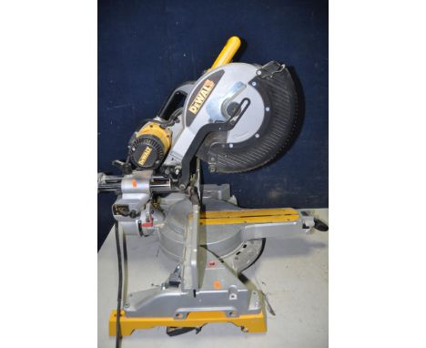 A DEWALT DW718LX CHOP SAW (PAT pass and working) with a DeWalt DE7023 universal leg stand/table and a DeWalt DC410KA cordless