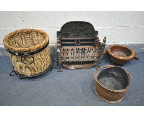 A CAST IRON FIRE GRATE, a circular wicker log basket, on a wrought iron base, a hardwood pestle, and a copper coal bucket (4)