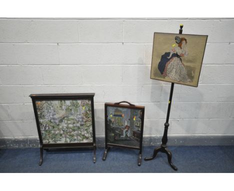 A 20TH CENTURY MAHOGANY NEEDLEWORK FIRESCREEN, on splayed legs, 67cm x 80cm, along with a Georgian mahogany needlework pole s