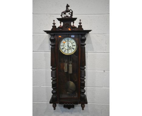 A LATE 19TH CENTURY GUSTAV BECKER VIENNA WALL CLOCK, with a resin horse pediment, the enamel dial with roman numerals, second
