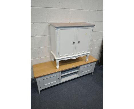 A PARTIALLY PAINTED AND OAK LOW TV STAND, width 144cm x depth 39cm x height 49cm, and a painted appleby wood two door cabinet