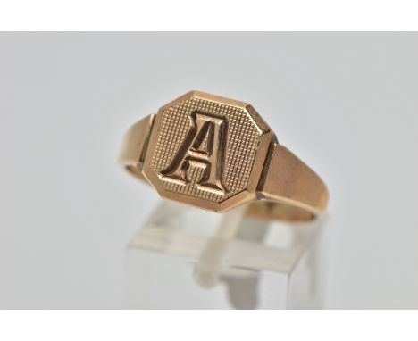 A 9CT GOLD SIGNET RING, square signet with cut off corners, engine turned design with engraved initial 'A', tapering shoulder