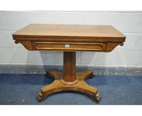 A VICTORIAN ROSEWOOD CARD TABLE, the fold over top enclosing a circular green baize playing surface, on an octagonal tapered 