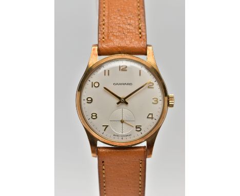 A 9CT GOLD 'GARRARD' WRISTWATCH, hand wound movement, round white dial signed 'Garrard' 'Swiss movement', Arabic numerals, su