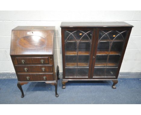 A SLIM REPRODUCTION MAHOGANY BUREAU, with three drawers, on cabriole legs (key) (condition:-fall front door faulty and not cl