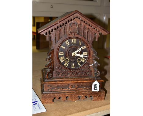 AN OAK CASED MANTLE CUCKOO CLOCK, has the original key and cuckoo still calls on the hour, white Roman numerals and hands, he