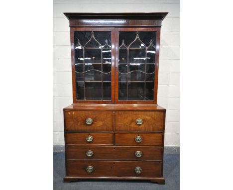 A GEORGE III MAHOGANY SECRETAIRE BOOKCASE, the top with an overhanging cornice, double astragal glazed doors, enclosing two d