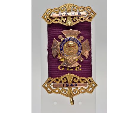 A 9CT GOLD R.A.O.B WITH PURPLE RIBBON, the central panel AF, embossed Buffalo with red enamel eyes, to the blue enamelled sur
