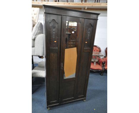 AN OAK MIRRORED SINGLE DOOR WARDROBE, width 91cm x depth 43cm x height 188cm (key)