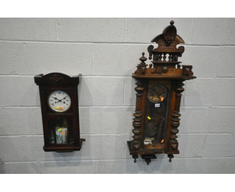 A LATE 19TH CENTURY WALNUT VIENNA WALL CLOCK, height 107cm, and a mahogany wall clock, both with key and pendulum (condition: