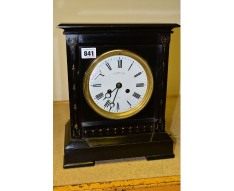 A BLACK SLATE MANTLE CLOCK, SIGNED NATHAN &amp; CO TO THE DIAL, the dial having Roman numeral hour markers, unsigned bell str