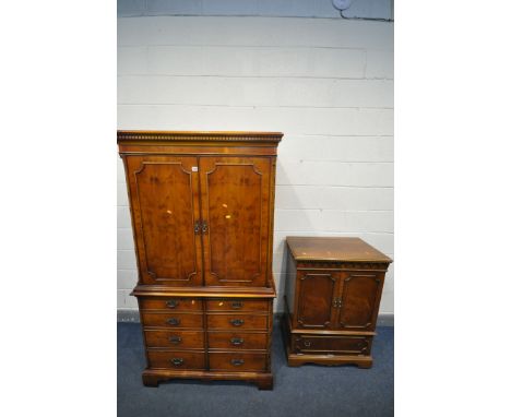 A YEWWOOD TWO DOOR TV CABINET, enclosing a slide and drawers, over double cupboard doors, width 100cm x depth 61cm x height 1