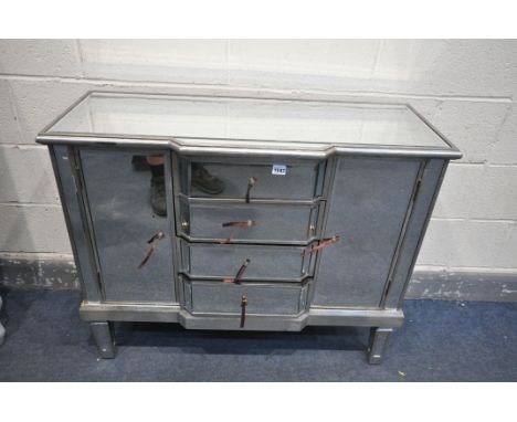 A MIRROR WRAPPED SIDEBOARD, with cupboard doors flanking four drawers, width 100cm x depth 40cm x height 81cm (condition:-goo