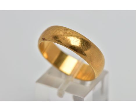 A YELLOW METAL WIDE BAND RING, plain polished wide band, approximate width 6.2mm, stamped '18ct', with possible Australian co