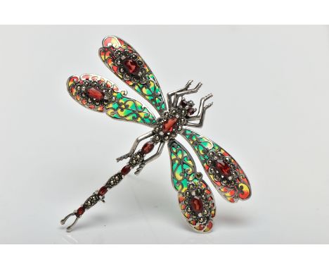 A PLIQUE A JOUR, GARNET AND MARCASTITE DRAGONFLY BROOCH, the dragonfly set with a marquise cut garnet and marcasite set body 