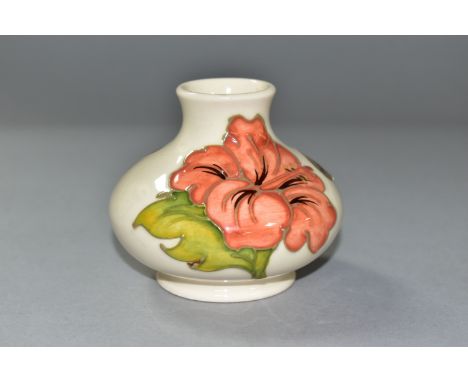 A SMALL MOORCROFT ORANGE HIBISCUS PATTERN VASE, of squat baluster form, foil label to the side, approximate height 7cm, Condi