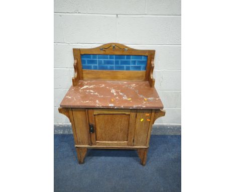 AN EDWARDIAN SATINWOOD WASHSTAND, with a tile back, marble top, and single door, width 83cm x depth 46cm x height 109cm (cond