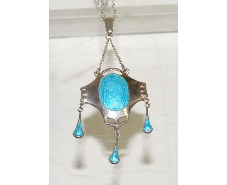 An Art Nouveau silver and enamel pendant by "CHARLES HORNER" and hallmarked for Chester 1911.  The blue enamel pendant with t