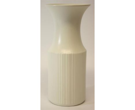 A 1960's white glaze ceramic vase, with cylindrically formed body, with vertical line detail.  Tapering neck leading to a wid