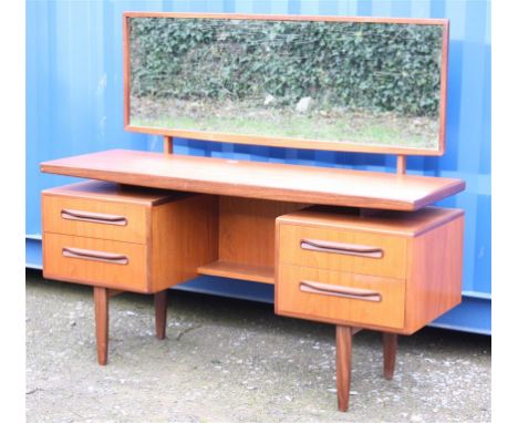 A G-Plan "Fresco" teak dressing table with full width mirror.  145cm wide, 46cm deep, 73cm high.  