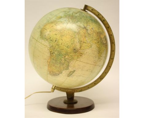 A 1963 Replogle Globes Inc.  Illuminating light up true-to-life globe, with wooden base.  Globe diameter 29 cm.