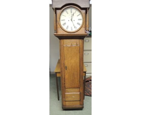 A large oak cased 8 day wall clock having circular 35cms cream painted dial with black Roman numerals and subsidiary seconds 