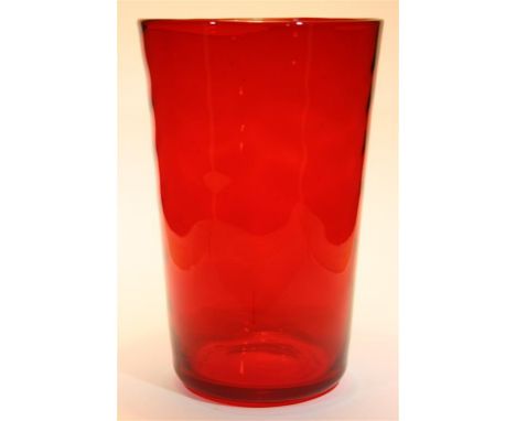 A Whitefriars Ruby red vase with waved ribbed design.  Pattern number 8473.  By Marriott Powell. 23cm high. 